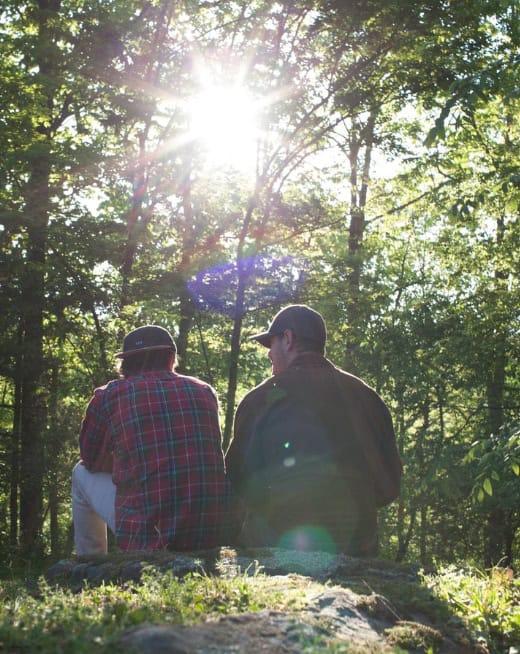 Men talk during a hiking excursion during drug addiction treatment in Lawrenceville, GA.