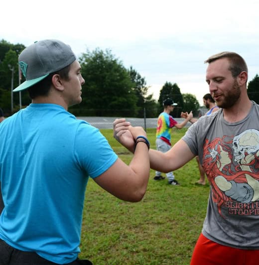 Men enjoy an activity during dual diagnosis treatment in Lawrenceville GA.