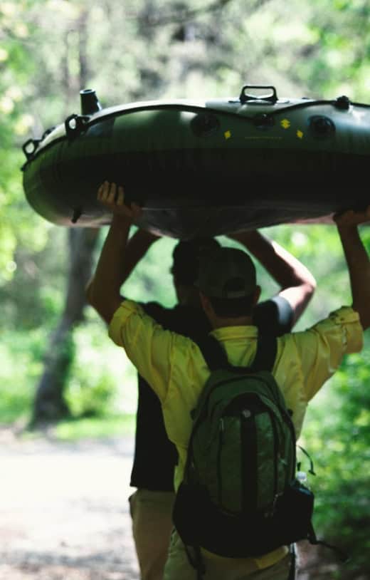 Men enjoy rafting as part of experiential therapy through our drug addiction treatment in Lawrenceville, GA.