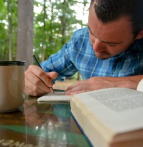 A man enjoys journaling during inpatient rehab in Lawrenceville, GA.