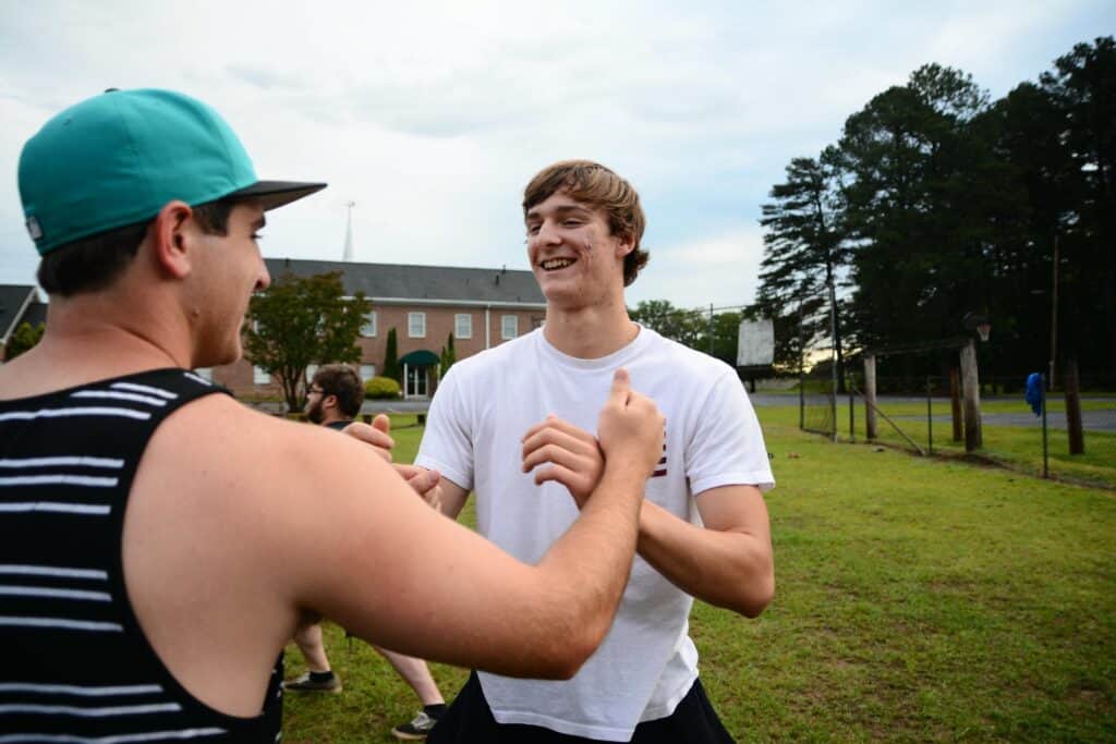 Man greeting a peer within the rehab alumni in Lawrenceville, GA.