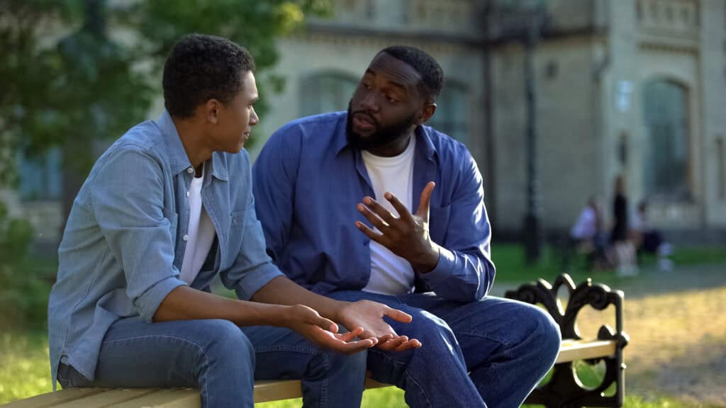 A father and son discussing Rehab for Young Men in Georgia.