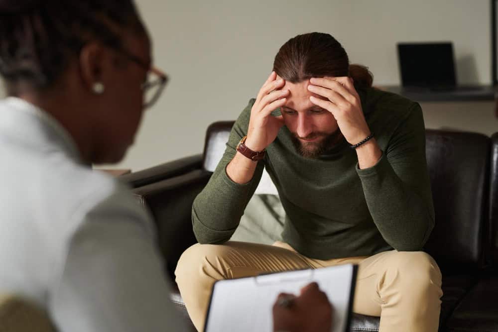 Man discussing his concerns during a mental health treatment session in Lawrenceville, GA.