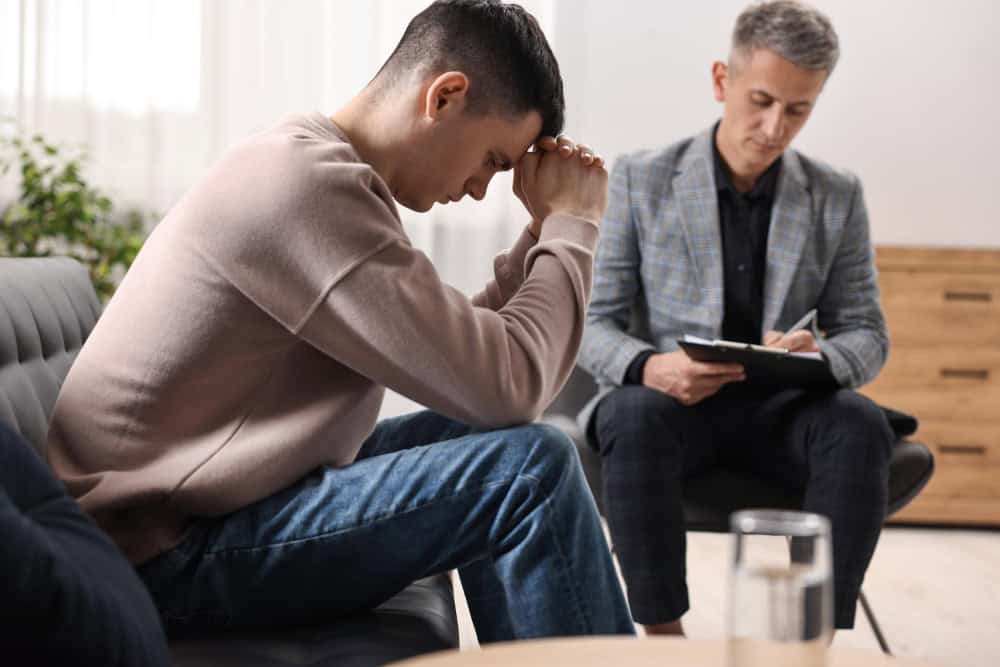 Psychotherapist working with a patient during therapy for PTSD in Lawrenceville, GA.